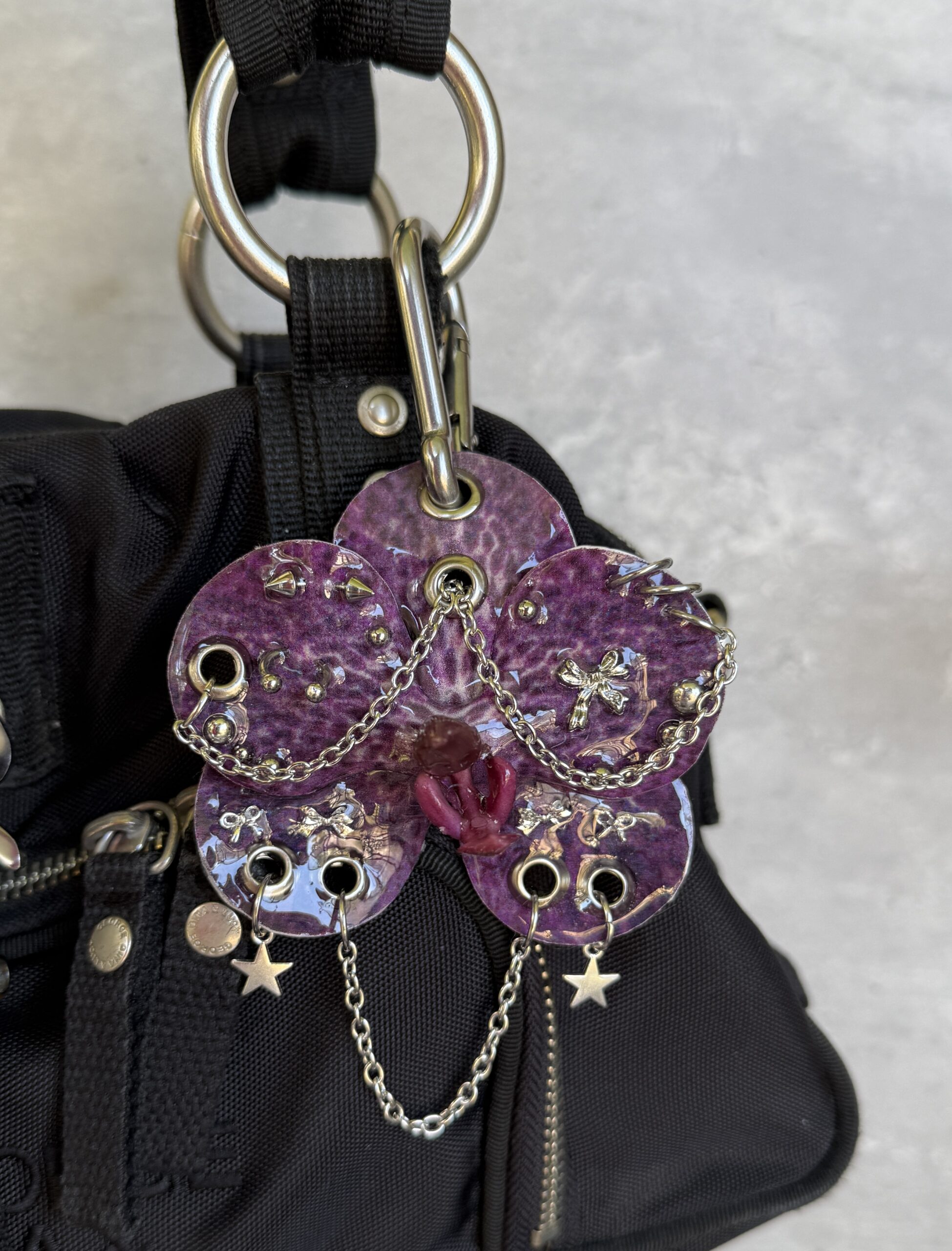 Dark Coquette Bag Charm • Deep Plum Purple and Bright Silver • Resin Orchid with Spiked Bows, Stars and Pierced Petals Trinket - Image 2